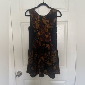 Black and brown tortoiseshell, mini dress with pockets and open back
